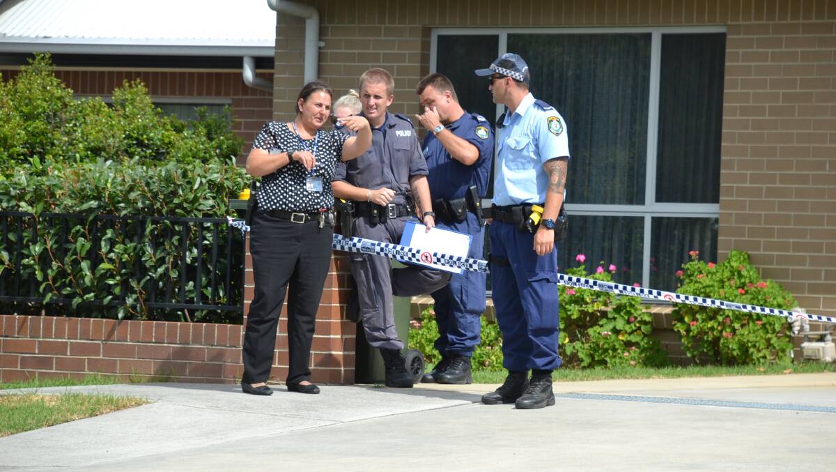 OPERATION: Shoalhaven detective Lydia Hill directs fellow oficers during the operation in Nowra.