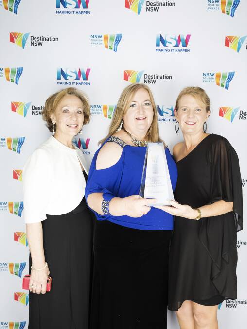 HAPPY WINNERS: Eurobodalla Tourism’s Kerrie-Anne Benton (left), South Coast RTO chairperson Catherine Shields and secretary Diane Johnston accept the gold award for the Unspoilt campaign at the  NSW Tourism Awards.