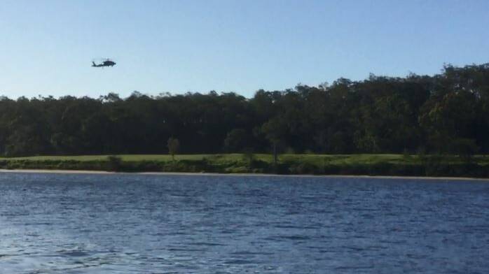 A navy Seahawk helicopter lands at a rural North Nowra property to drop off personnel to a squadron Christmas party. Photo: Footage from video - Contributed
