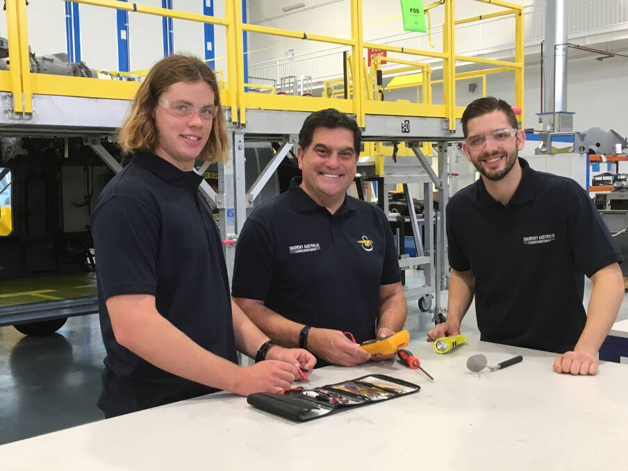 WELCOME ABOARD: Lockheed Martin Australia chief executive Vince Di Pietro (centre) with new apprentices at the Nowra operation Matthew Lawrence (left) and Sean McAleer.
