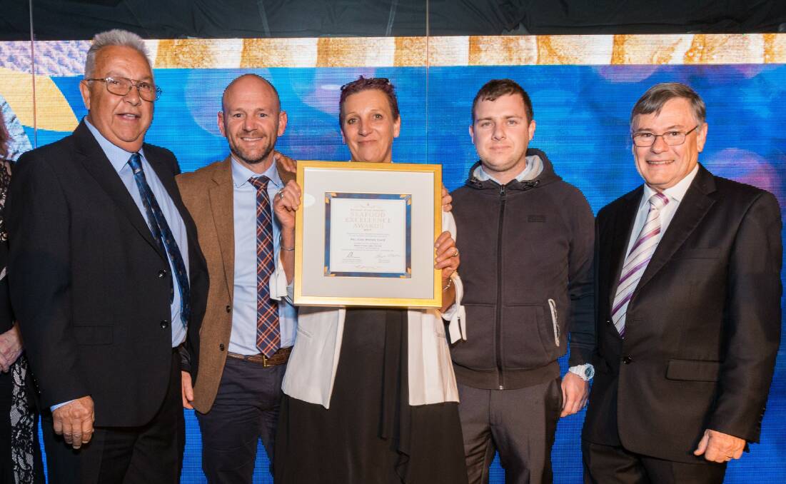 Ron Cardow, Sharon Gould and Brad Shepherd from Pelican Rocks Cafe accept the award at the Sydney Fish Market Seafood Excellence awards from Minister for Primary Industries, Regional Water, Trade and Industry Niall Blair and Sydney Fish Market general manager Bryan Skeppe. Photo:EventPix