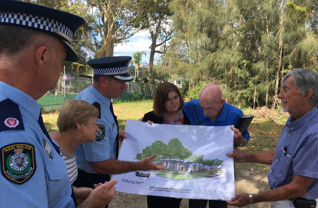 Residents look over the plans of the new Bay and Basin Police Station with Southern Region Commander Peter Barrie, Shoalhaven Local Area Commander Superintendent Steve Hegarty and South Coast MP Shelley Hancock.