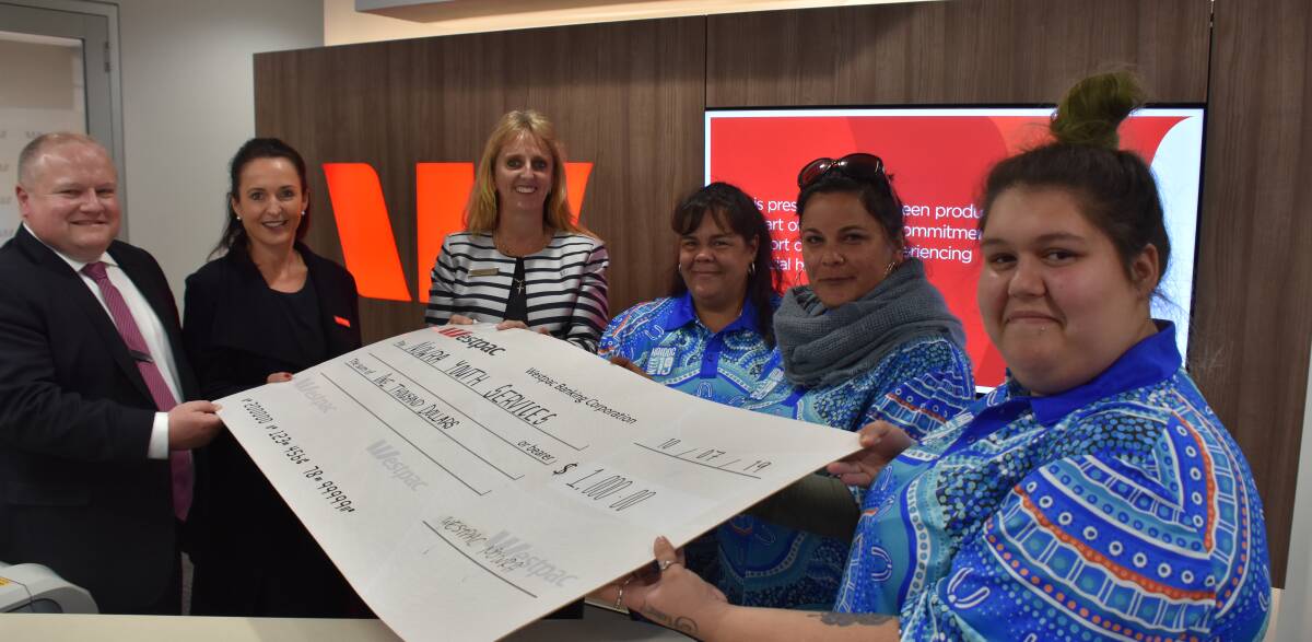 SPECIAL OPENING: Westpac regional general manager Josh Kellett, state general manager Jo Moxey and Nowra bank manager Nicole Carter present the $1000 community grant to Janet Atkins (manager), Nicole Moore (chairperson) and Chloe Seymour (volunteer) from the Nowra Youth Centre.