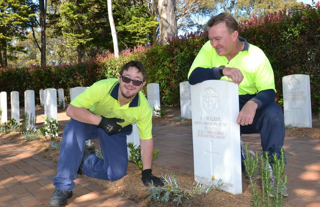 UPGRADE: Nowra RSL Sub-Branch secretary Rick Meehan and his son Luke maintain the new-look Nowra War Cemetery.