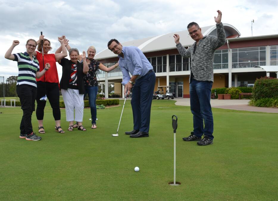 ON LINE: Sponsor Brendan Goddard and  chamber vice-president Hayley Byrne launch this year’s golf day with Ash Hudson, of Safe Shelter Shoalhaven, Lyn Gerstenberg, of Shoalhaven Women's Health Centre, Jane Ford of CareSouth Shoalhaven Youth Support Services and Peter Dover, of Safe Shelter Shoalhaven.