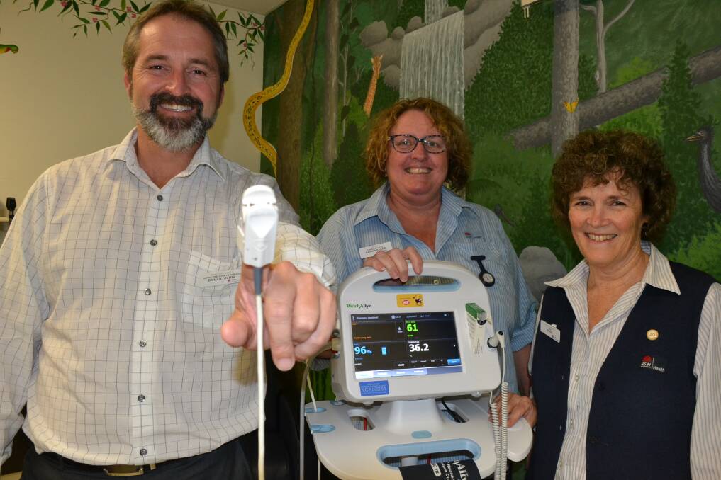Shoalhaven District Hospital Acting Director of Nusring and Midwifery Brad Scotcher gets a demonstration of the Connex Vital Signs Monitor by ED Clinical Nurse Educator Sharyn Balzer and ED Nurse Unit Manager Wendy Fetchet.