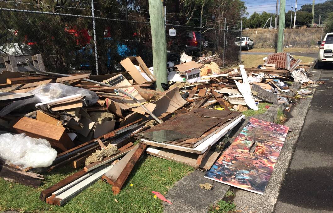 SHAME: Unauthorised loads of dumped rubbish on Swan Street Wollongong, with the added bonus of an address left amongst the pile alerting authorities to who may be responsible. Wollongong City Council had to call in a backhoe to remove the piles.