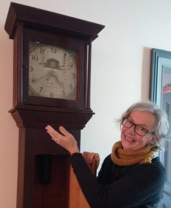 Visitor Interpretation Officer at Nowra's much loved historic property, Meroogal, Cheryl Scowen, with the old clock that survived the great flood at Terara.