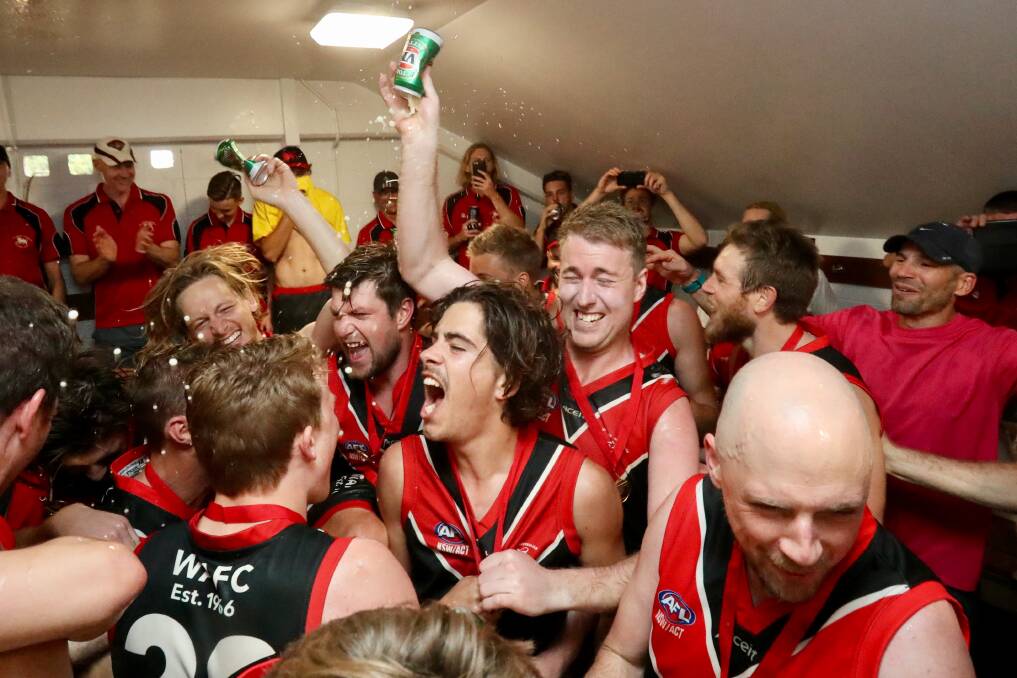 Party time: Lions players celebrate after singing the team song at North Dalton Park on Saturday. Picture: Adam McLean