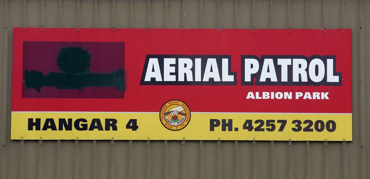 A reference to former naming rights sponsor Bendigo Bank is blacked out on a sign at the aerial patrol's Albion Park hangar last month. Picture: Robert Peet