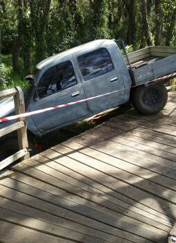 STUCK: The ute came off the boardwalk and hit a rail before coming to a halt.