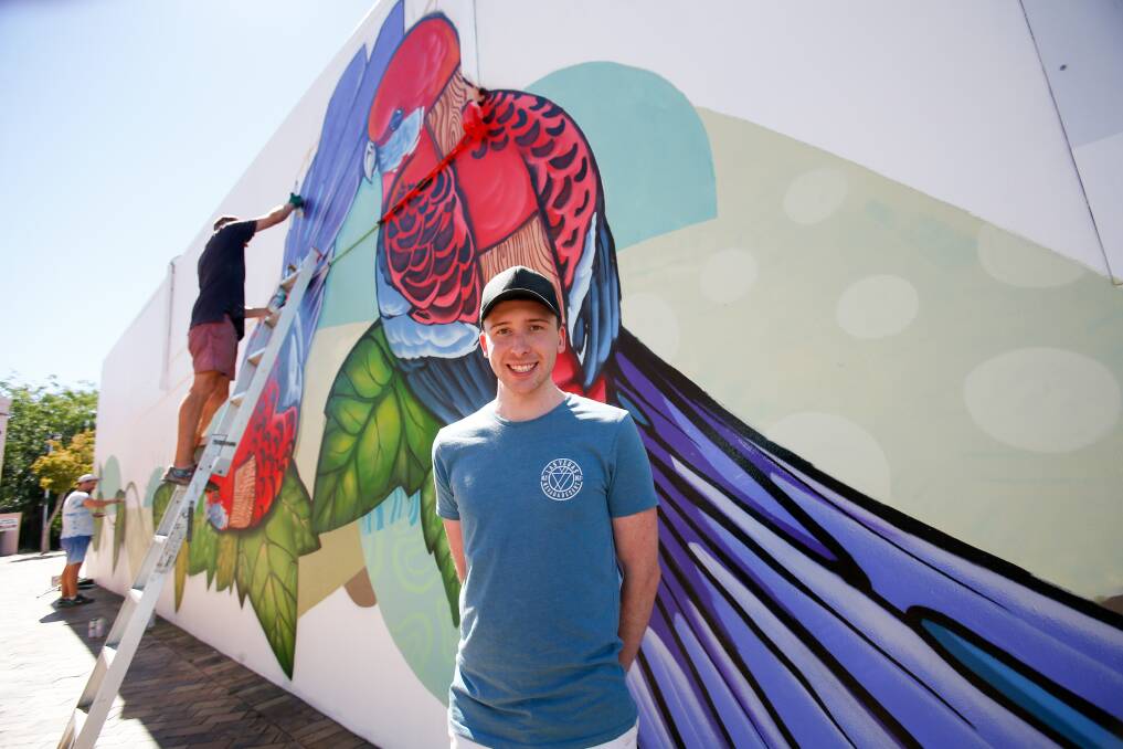 NEW LIFE: ‘Dapto is finally getting a taste of the street art scene that has been spreading around Wollongong,’ says Chase Murrary of Dapto’s first giant mural by street artist Krimsone. Picture: Adam McLean