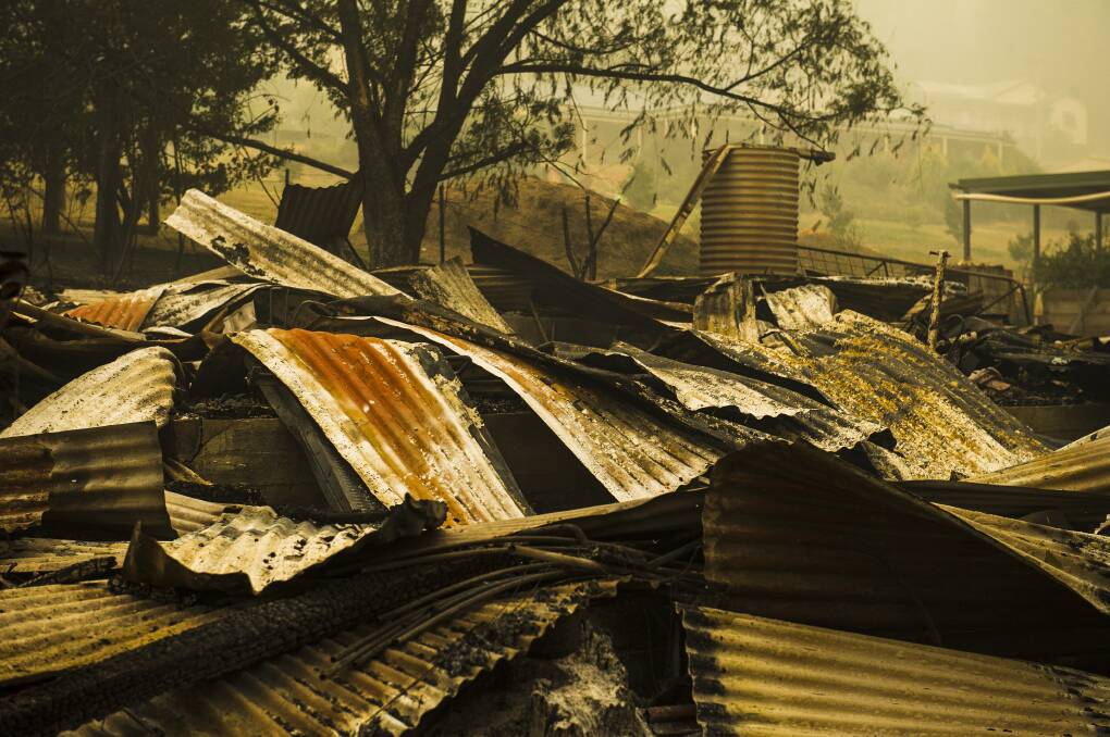 Some of the wreckage left by bushfires that impacted Batlow on Saturday. Picture: Dion Georgopoulos