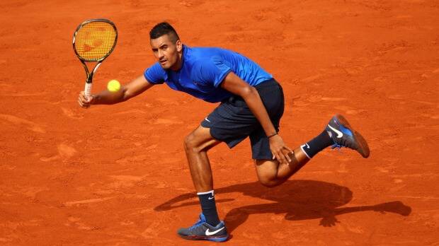 Nick Kyrgios on his way to the exit gate at the French Open. Photo: Clive Brunskill/Getty Images
