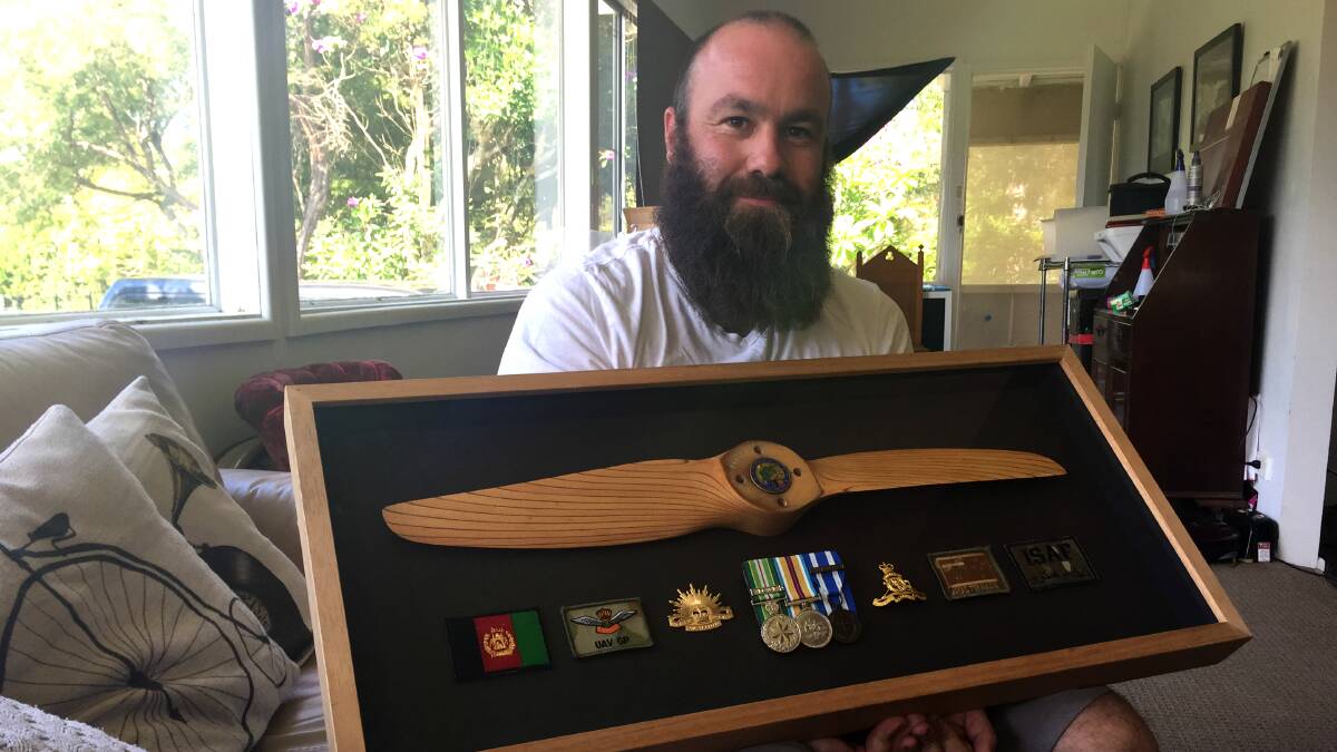 HONOUR: Ash Wilke with a display of his medals. One of the main things Ash remembers on Anzac Day is the men who died while he was on tour in Afghanistan. 