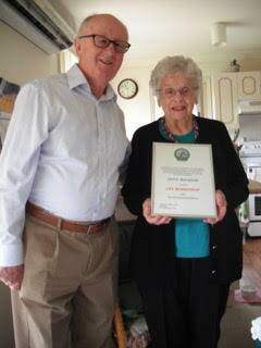 ACHIEVEMENT: George Windsor OAM presents Doris Barnfield with her with Life Membership of the Eisteddfod.