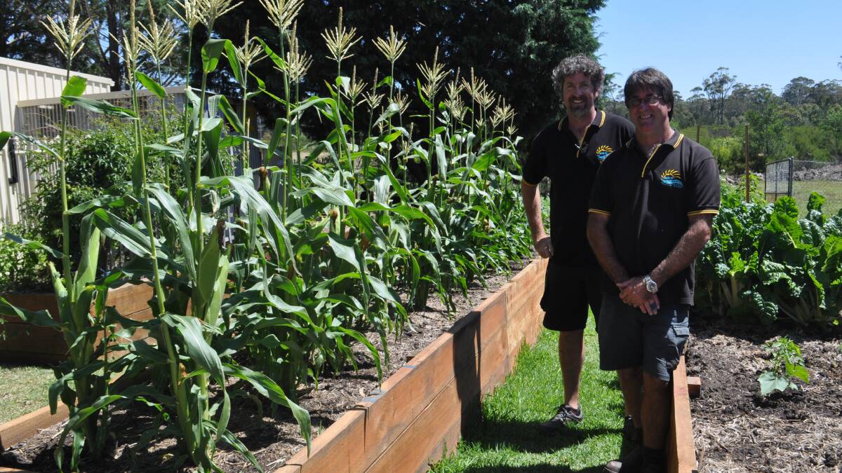 FLOURISH: Brad Slaughter and Steve Collins said the garden beds created by the Bay and Basin Community Resource Work for the Dole participants are an asset for the community.  