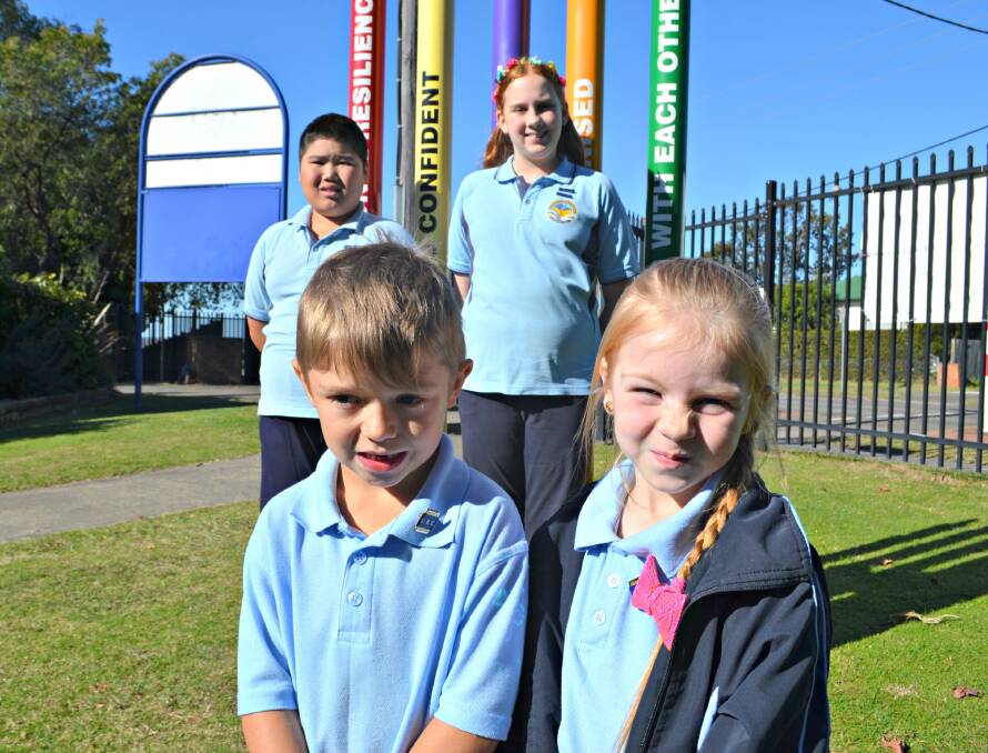 EVERYONE WELCOME: Kindergarten students Troy Fittler and Honour Grout (front) and school captains Jordan Pham and Violet Venn welcome everyone to Bomaderry Public School's 150th celebrations.