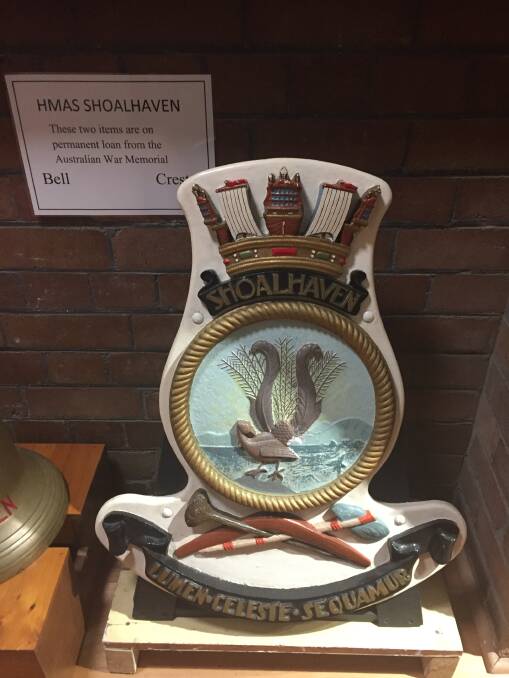 MEMORABILIA: The ship’s bell and crest are on permanent loan from the Australian War Memorial to the Shoalhaven Historical Society. 

