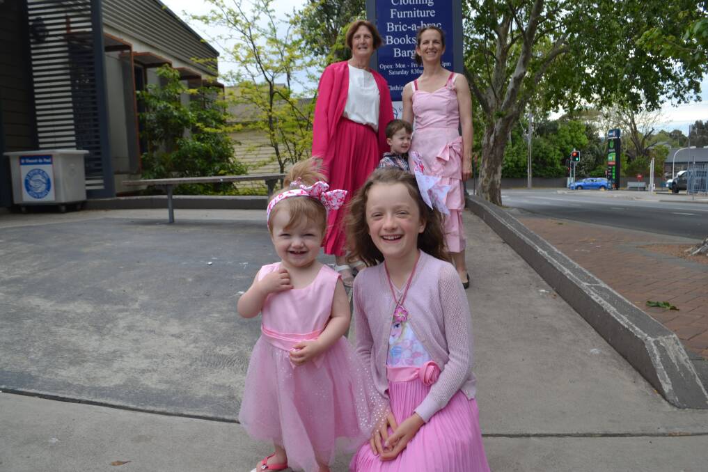 12 YEARS RUNNING: Gemma and Chloe Balsar (front), Barbara Showmark, and Elijah and Carla Balsar encourage everyone to don their op shop pinks and join the fun on October 28. 