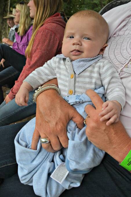 Two-month-old William Warnes watching mum and dad compete in the cattle section.