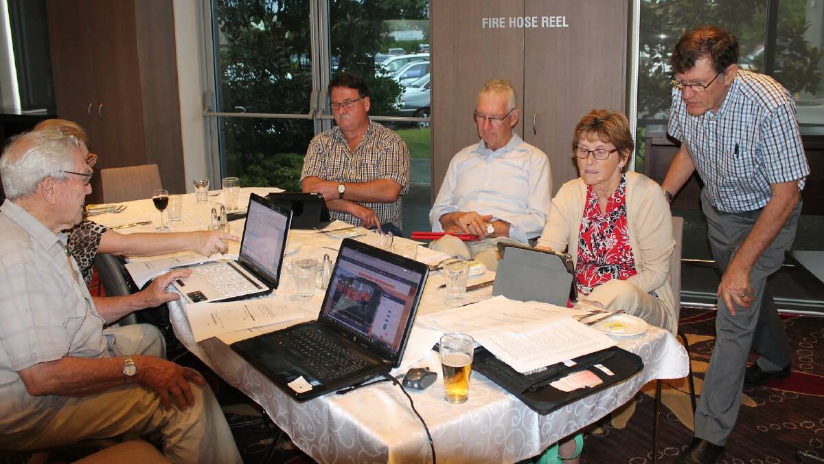 Nowra Rotarians being shown how to navigate the new Rotary Nowra website.
