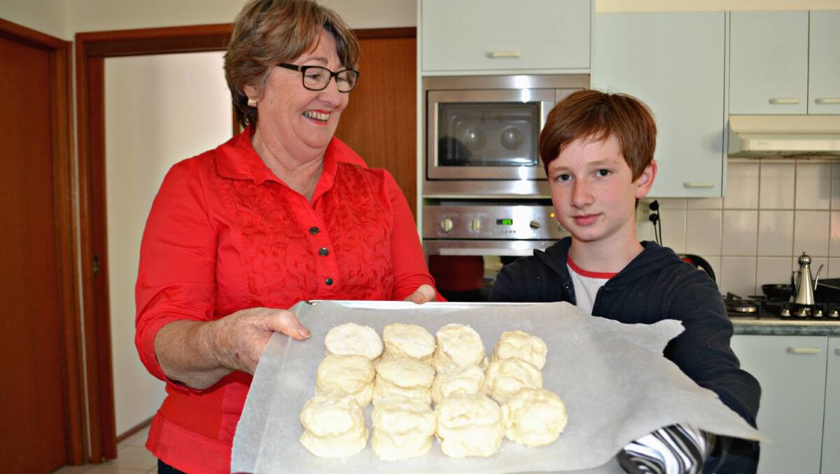 HEATING UP: Dale Wells and Josh Weakley prepare for Nowra Library’s Great Intergenerational Bake Off on Thursday, October 27. Entries are now open.