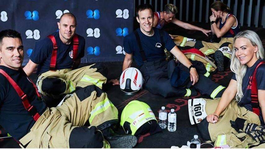 VICTORY: Hayley with her fellow firefighters after reaching the top of the Melbourne Firefighter Stair Climb. Photo: supplied. 