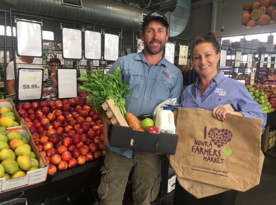 PLASTIC BAN: Nowra Farmers market director Jeffrey Coe and staff member Kaylee Wood show off the store's sustainable alternatives to plastic bags.
