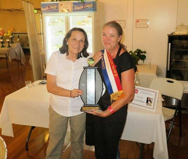 Cheese judge Carole Willman congratulates the winner of the Champion Dairy Product at the inaugural Cheese and Dairy Section of the 2017 Kangaroo Valley Show. It was taken out by a creamy blue cheese. Photo: @valleycheesemakers