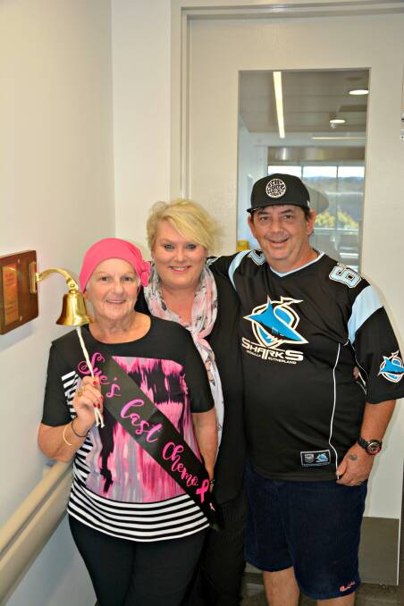 SWEETEST SOUND: Sue Gregan rings out the treatment bell with Karlene and Craig Hosking. 
