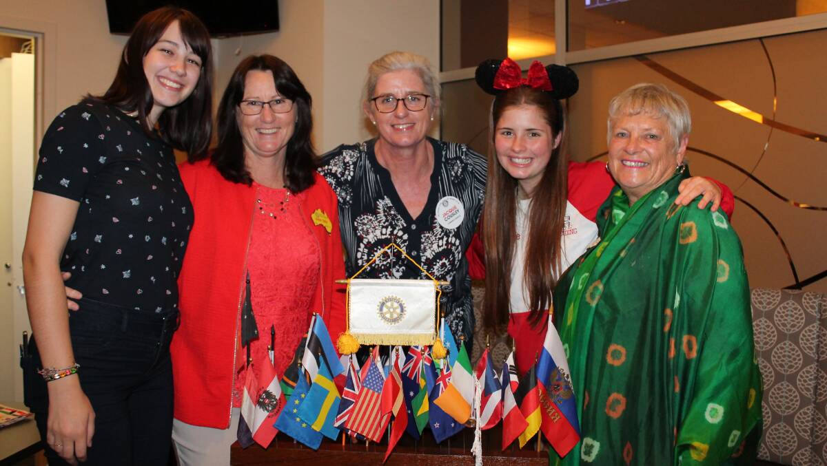 TALES TO TELL: Holly Weyman, District Exchange officer Karen Trigg, Rotary Nowra Youth Director  Jaquie Cousley, Makenzie Veale and District Exchange Chair Rob Uhi enjoying the International night. Photo contributed. 