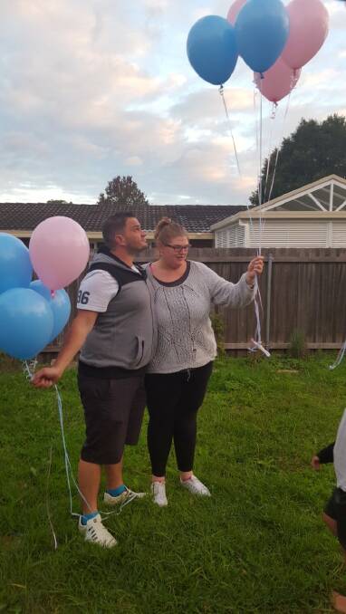 LOVE: Josh Carstairs and Nicole Hampton release balloons in memory of their baby. 
