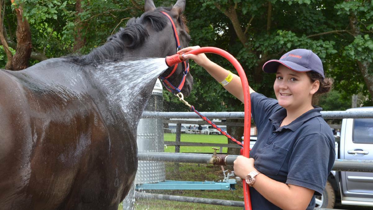 STAY COOL: Kila Campbell from Cambewarra cools off Edward after competing in the 2016 Nowra Show. The show committee is ensuring plenty of hot weather policies will be in action at the 2017 show, after temperatures are predicted to reach the early 40s. 
