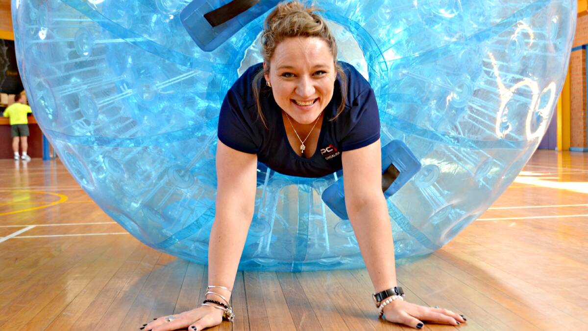ROLL ON DOWN: Sam Kettlewell, PCYC Shoalhaven manager is encouraging everyone to come along to the movie night,  showcase and car boot sale, and have some fun with the new zorb balls.