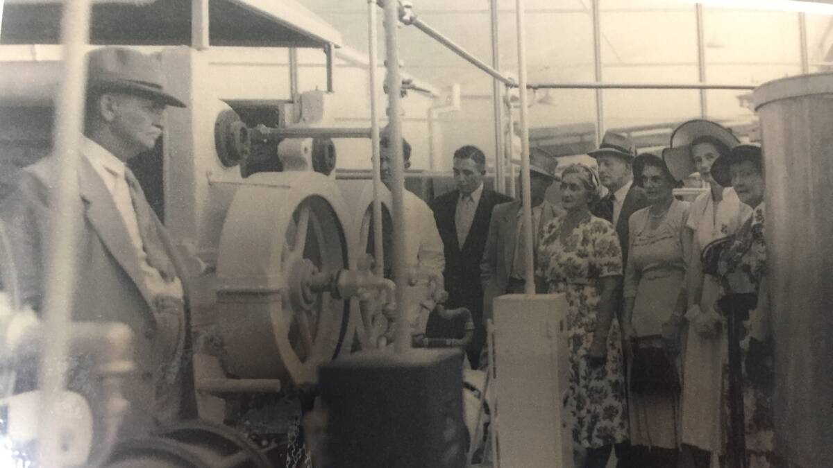 UNDERWAY: Residents are taken on a tour of the new factory in the 1950s. Photo: Shoalhaven Historical Society. 