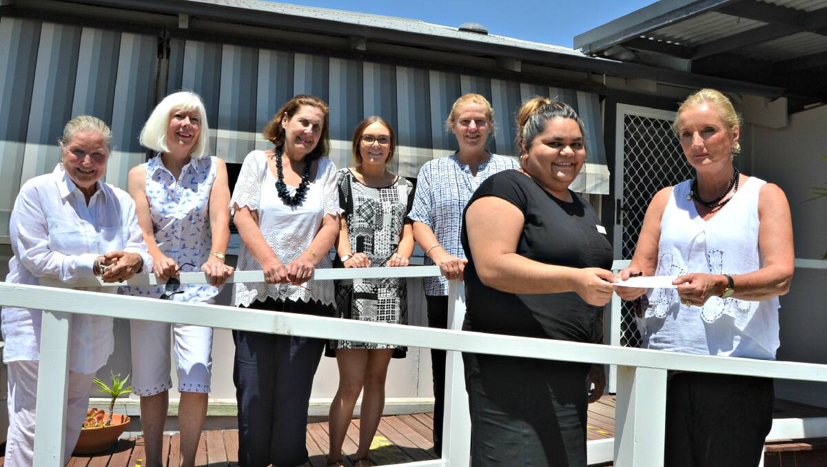 Sandy Munro, Penny Johnson and Fran Smith from Friends of Waminda, Berrima Blakeney from Waminda, Faye Worner, CEO of Waminda watch as Cleone Wellington, administration manager at Waminda is presented with a cheque for $13,000 by Amanda Lopez from Friends of Waminda (front, right). 