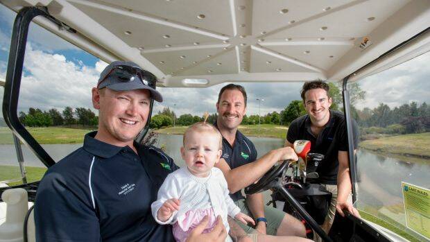 Zach Douglas, ten-month-old Audrey Douglas, celebrity Movember ambassador Sasha Mielczarek, and Movember campaign manager Ben O'Connell at the Stevie D Memorial Golf Day in Canberra on Friday. Photo: Sitthixay Ditthavong
