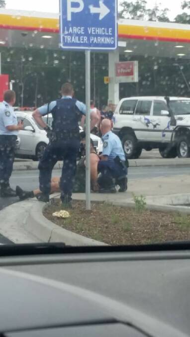 A van has crashed into a petrol station bowser at South Nowra. Photo: Dayle Latham