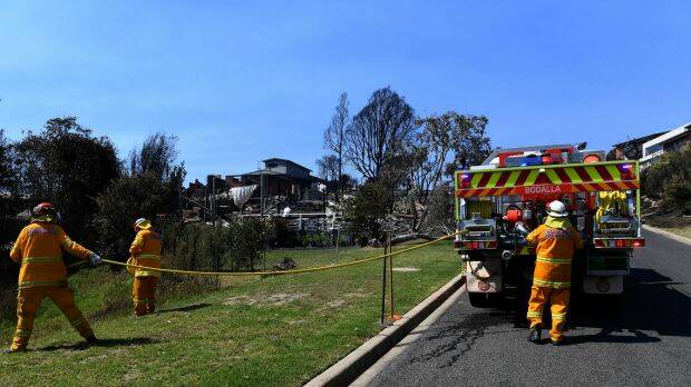 The Rural Fire Service was on scene within 15 minutes of the first triple zero calls, but declined offers for help from NSW Fire and Rescue until the fire was baring down on Tathra's streets. Photo: AAP
