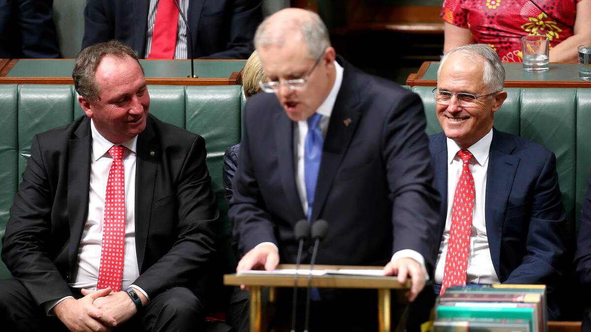 Deputy Prime Minister Barnaby Joyce and Prime Minister Malcolm Turnbull listen as Treasurer Scott Morrison delivers the Budget speech. Photo: Alex Ellinghausen