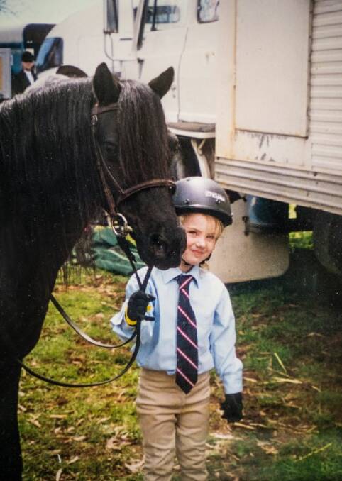 Olivia Inglis at age five, with her first pony. Photo: supplied

