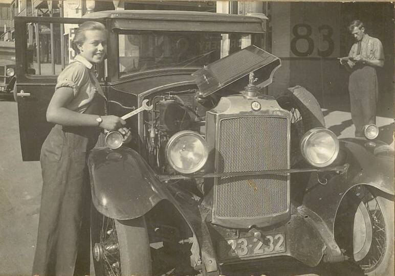 Sheila Agnes Grey (then Williamson) working as a mechanic at the Williamson's family garage on Cooma Street, Yass, aged 16. Photo: Supplied