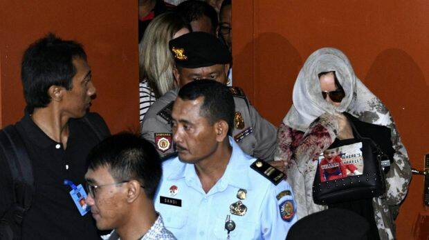 Convicted Australian drug smuggler Schapelle Corby leaves the parole offices in Denpasar after signing papers before being deported today from Ngurah Rai International Airport, Bali.  Photo: James Brickwood
