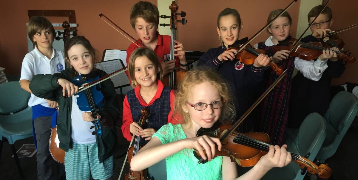 STRING SONG: Members of the Shoalhaven Junior Strings Leo Gallenca, Mila Clarke, Jonathan Walsh, Tamsin Walsh, Abi Heard, Amelia Janezic, Claire Ennis and James Paterson are the Shoalhaven's up and coming talent.