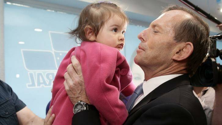 Tony Abbott's paid parental leave scheme could be the next election promise to be revised. Photo: Alex Ellinghausen