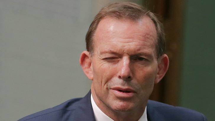 Trump has "reasonable" policies: Tony Abbott winks as he departs Question Time on Thursday. Photo: Alex Ellinghausen