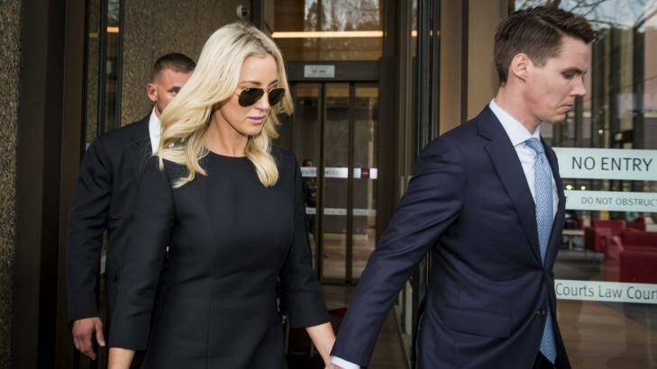 Oliver Curtis and wife Roxy Jacenko leave his sentencing hearing at the Supreme Court on Friday. Photo: Anna Kucera