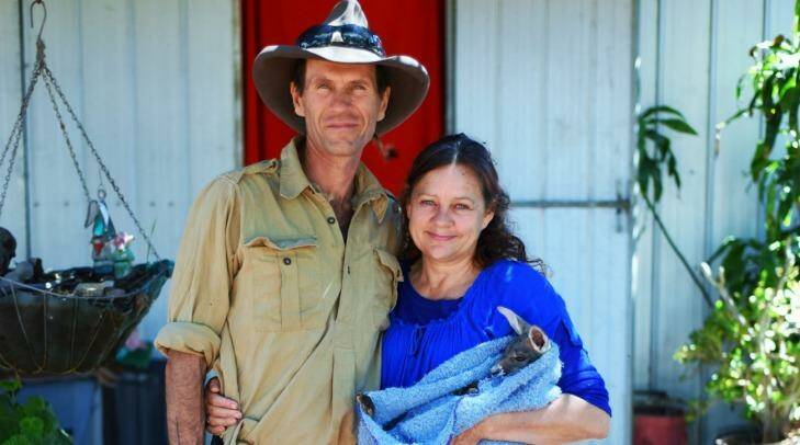 Kye Schaaf and Gill Wheadon with a baby joey they saved. Photo: Nick Moir