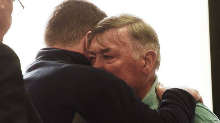 Barry Lyttle reunited with his father Oliver, outside Central Local Court, after being released on bail earlier this month. Photo: Nick Moir